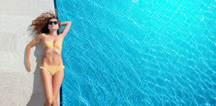 woman-relaxing-in-swimming-pool